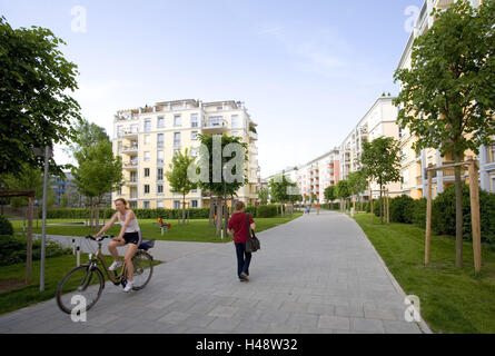 Germany, Bavaria, Munich, Haidhausen, residential houses, new buildings, passers-by, town, part town, Munich-Haidhausen, houses, housing development, new building settlement, living, new building, new building area, flats, way, cyclist, cycle track, footpath, pedestrian, person, trees, covers with greenery, building, architecture, Stock Photo