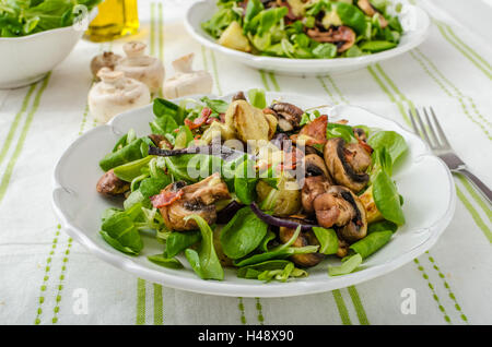 Salad with new potatoes and blue cheese, bacon, olive oil and great dressing from dijon mustard Stock Photo