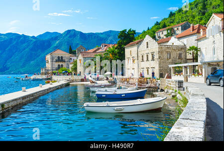 The tiny port in the city centre of Perast makes it even more idyllic and cozy, Montenegro. Stock Photo