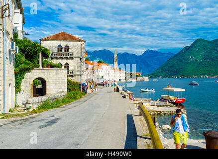 The small medieval resort of Perast is hidden among the mountains on the coast of Kotor bay Stock Photo