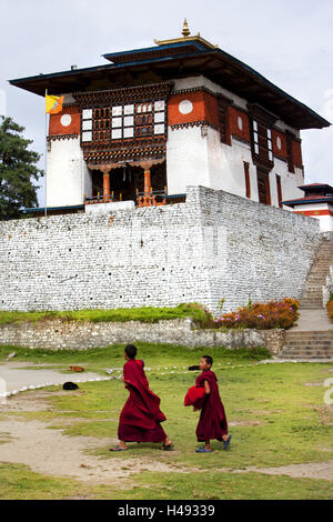 Kingdom Bhutan, young monks before cloister, Stock Photo