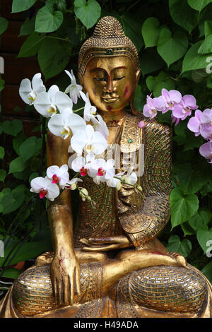 Buddha's statue, orchids, Stock Photo