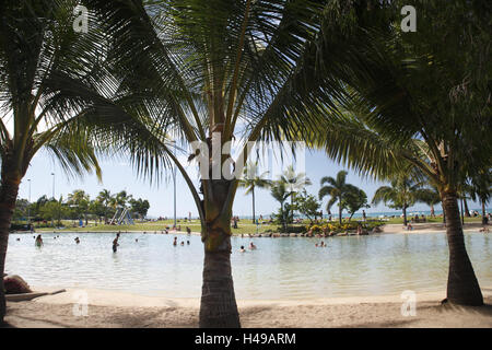 Australia, Whitsunday Coast, Airlie Beach, Airlie Lagoon, bathers, Whitsunday islands, destination, lagoon, artificially, Whitsunday Iceland national park, recreation area, water, salted water, sea, vacation, swim, bathe, sunbathing, palms, Sand, people, sunny, outside, Stock Photo