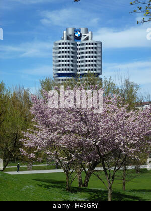 Germany, Upper Bavaria, Munich, Olympic complex, BMW high rise, blossoming cherry trees, Stock Photo