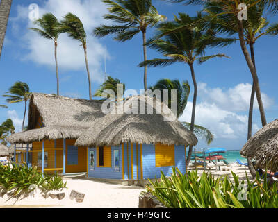 The Dominican Republic, Punta Cana, Playa Bavaro, coloured wooden steelworks with boat hire on the palm beach, Stock Photo