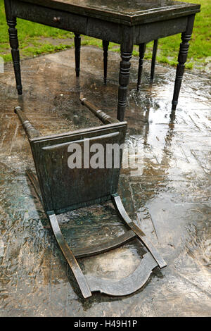 Table, chair, fallen down Stock Photo - Alamy
