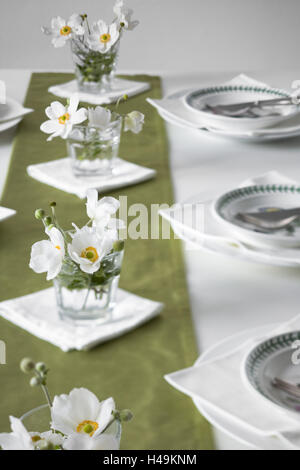 Table decoration, glasses with white Japanese anemones, Stock Photo