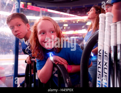 Tampa, Florida, USA. 13th Oct, 2016. DIRK SHADD | Times.Vincent Wood (left), 11, and his sister Leah Wood, 8, from Tampa, lean over the railing to look around the hockey sticks as the Tampa Bay Lightning players prepare to head down the tunnel for the pre game warm ups before taking to the ice against Detroit Red Wings for the season opener at the Amalie Arena in Tampa Thursday evening (10/13/16) © Dirk Shadd/Tampa Bay Times/ZUMA Wire/Alamy Live News Stock Photo