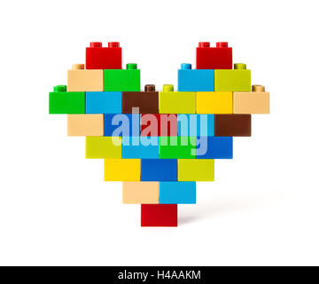 Heart made from colorful toy bricks on white with clipping path Stock Photo