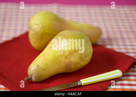 Two pears on red napkin, knife, Stock Photo