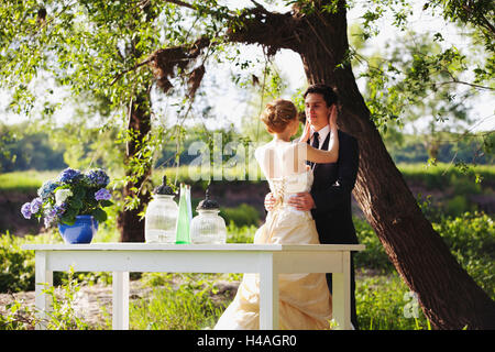 Bride and groom embracing in the nature Stock Photo