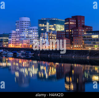 Düsseldorf, North Rhine-Westphalia, Germany, Gehry houses and Neuer Zollhof at dusk Stock Photo