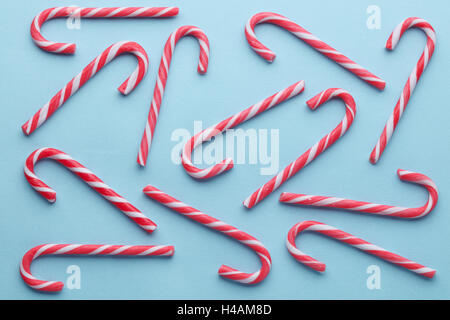 Christmas festive candy canes on blue background Stock Photo
