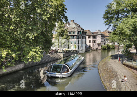 France, Alsace, Strasbourg, River Ill, shore, boat, people, houses, trees, Stock Photo