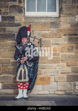 Edinburgh, Scotland -  02 September 2016 : Man playing traditional pipes on the streets of Edinburgh Stock Photo