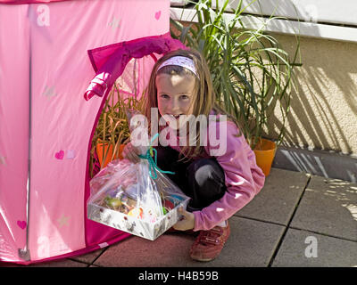 Easter, garden terrace, girl, happily, Easter present, Easter eggs, finds, Stock Photo