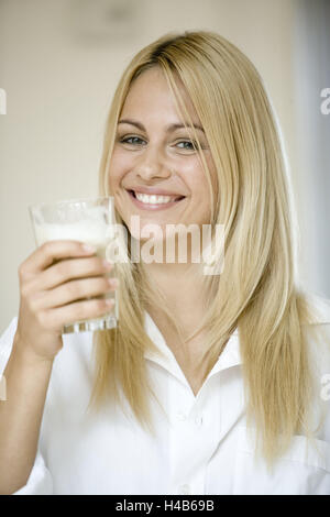 Woman, smile young, blond, glass, hold, Latte Macchiato, portrait, person, women's portrait, recreation, leisure time, consumption, froth, white coffee, coffee, sitting room, inside, happy, long-haired, Stock Photo