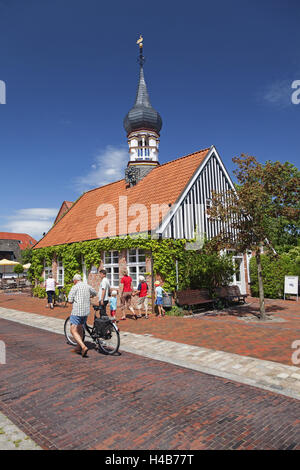 Hooksiel mussel museum with bulbous spire, former artist's house, school, town hall, health resort administration, Germany, Lower Saxony, Stock Photo