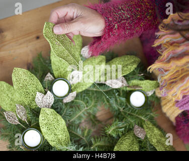 Woman makes Christmas decoration, medium close-up, detail, Stock Photo