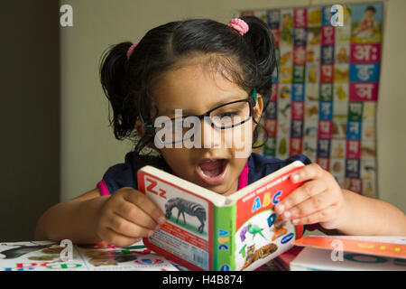 A school going kid studying at home, Pune, Maharashtra, India Stock Photo