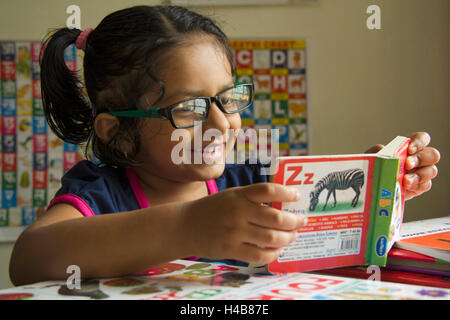 A school going kid studying at home, Pune, Maharashtra, India Stock Photo