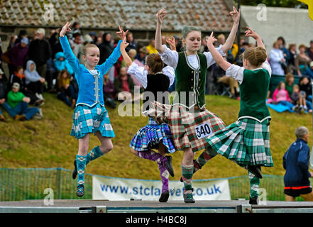 Girls dancing in kilts at the Ceres Highland Games folk dance competition, Ceres, Scotland, United Kingdom Stock Photo
