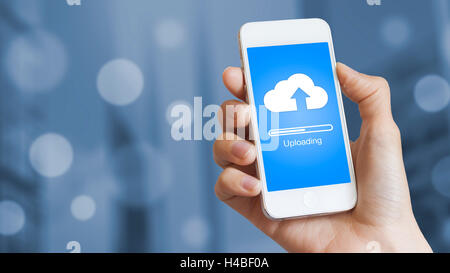 Cloud upload from mobile phone to store data on server Stock Photo