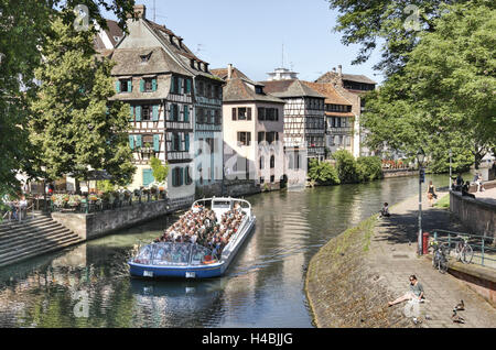 France, Alsace, Strasbourg, river Ill, shore, boat, people, houses, trees, Stock Photo