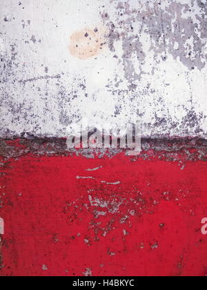 closeup shot of aged and decayed concrete surface in red and white Stock Photo