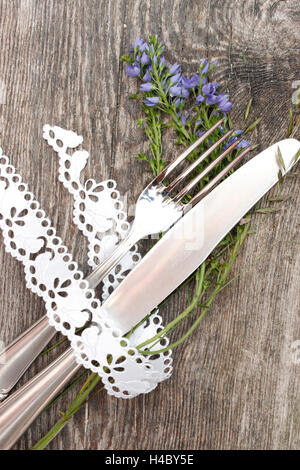 Cutlery, flowers, decoration ribbon Stock Photo