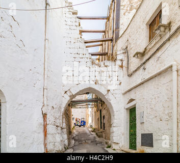 three wheels taxi in narrow streets of Ostuni, The White City Stock Photo