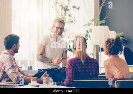 Young business people working at office on new project Stock Photo