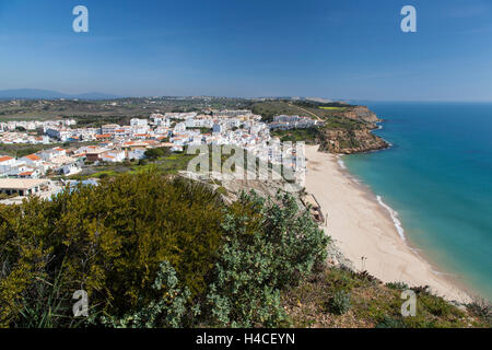 View on Burgau as seen from the coastal footpath at the Atlantic in Luz, towards Salema along the impressive rock coast in the Parque Natural do Sudoeste Alentejano e Costa Vicentina, Algarve, Portugal, Europe Stock Photo
