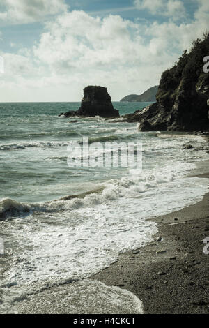 Rocky headland with waves on the South West Coast Path near St Austell, Cornwall, England UK Stock Photo