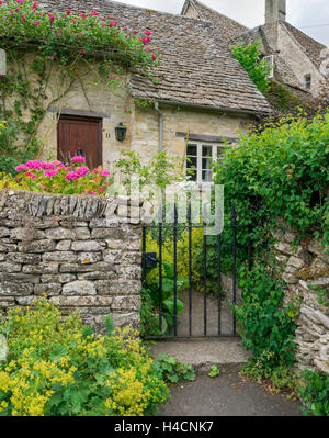 Great Britain, Gloucestershire, Bibury with Cirencester, cottage, stone house with garden defensive wall, The artist and author William Morris called Bibury' the fruit juice beautiful village in England', Stock Photo