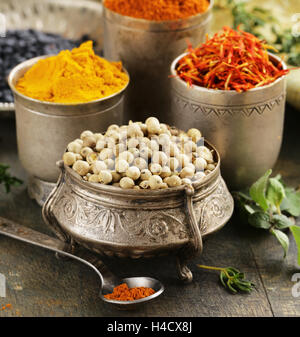 Assorted spices (saffron, pepper, turmeric, cinnamon) Stock Photo