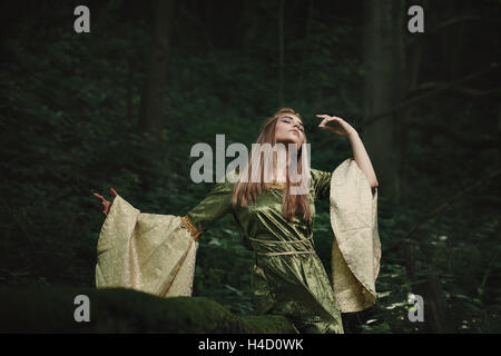 Elfin queen dancing in magical woods. Fairytale and fantasy Stock Photo