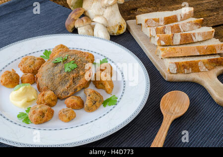 Fried mushrooms with home made bread, mushrooms from czech woods Stock Photo