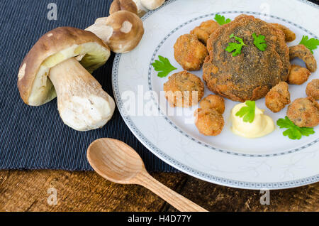 Fried mushrooms with home made bread, mushrooms from czech woods Stock Photo