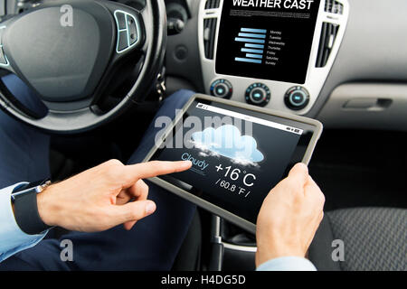 close up of man with tablet pc in car Stock Photo