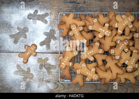 Gingerbread Men biscuits on a wire cooling rack Stock Photo