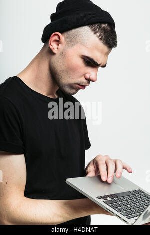 Handsome man using laptop. Stock Photo