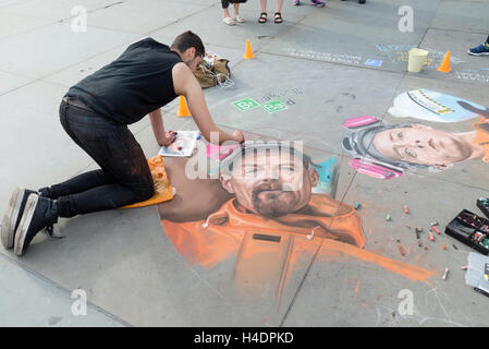 Street artist painting Mr White, the main character in the television series Breaking Bad, Trafalgar Square, London, England, UK Stock Photo