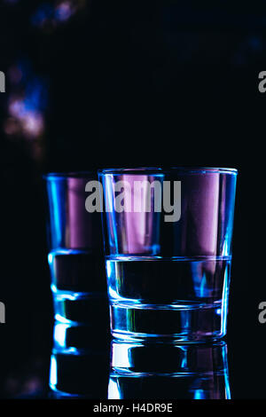 drinking glasses close-up on a dark background. Stock Photo