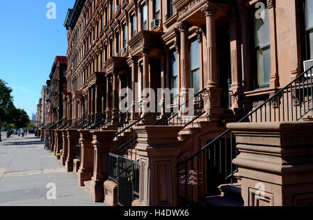 Renovated historic brownstone apartment building on Lenox Avenue aka Malcolm X Boulevard.Harlem.Manhattan,New York City,USA Stock Photo