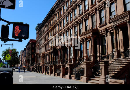 Renovated historic brownstone apartment building on Lenox Avenue aka Malcolm X Boulevard.Harlem.Manhattan,New York City,USA Stock Photo