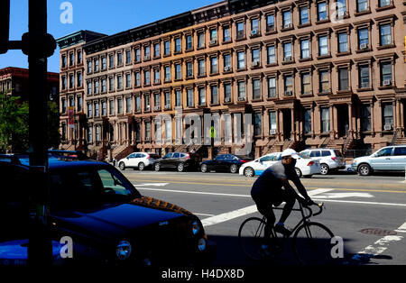 Renovated historic brownstone apartment building on Lenox Avenue aka Malcolm X Boulevard.Harlem.Manhattan,New York City,USA Stock Photo