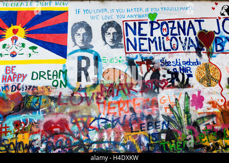 The John Lennon Wall. Tags and slogans as graffiti on the wall which has developed as a symbol of peace and protest in the Kampa Stock Photo