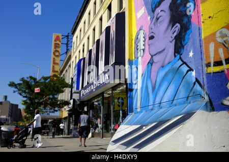 Street mural on 125th street with the sign of Apollo Theater in the ...