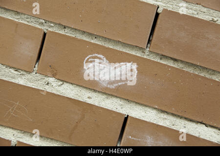 White heart painted on wall, symbol Stock Photo